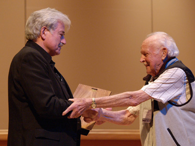 Bill Adam is presented with the ITG Award of Merit by Stephen Chenette, ITG President.